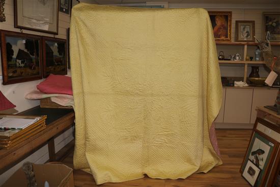 A rose pink and light pink reversible quilt, another reversible with yellow, the other mint green gingham and pink (3)